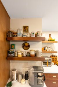 "Remodeled kitchen with custom brown cabinets and efficiently arranged storage."