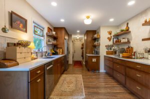 "Custom kitchen cabinets in rich brown tones with elegant hardware."