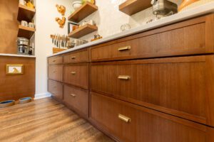 "Beautifully designed kitchen with custom cabinetry and open shelving."