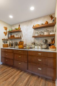 "Elegant kitchen design with brown cabinets and well-arranged storage spaces."